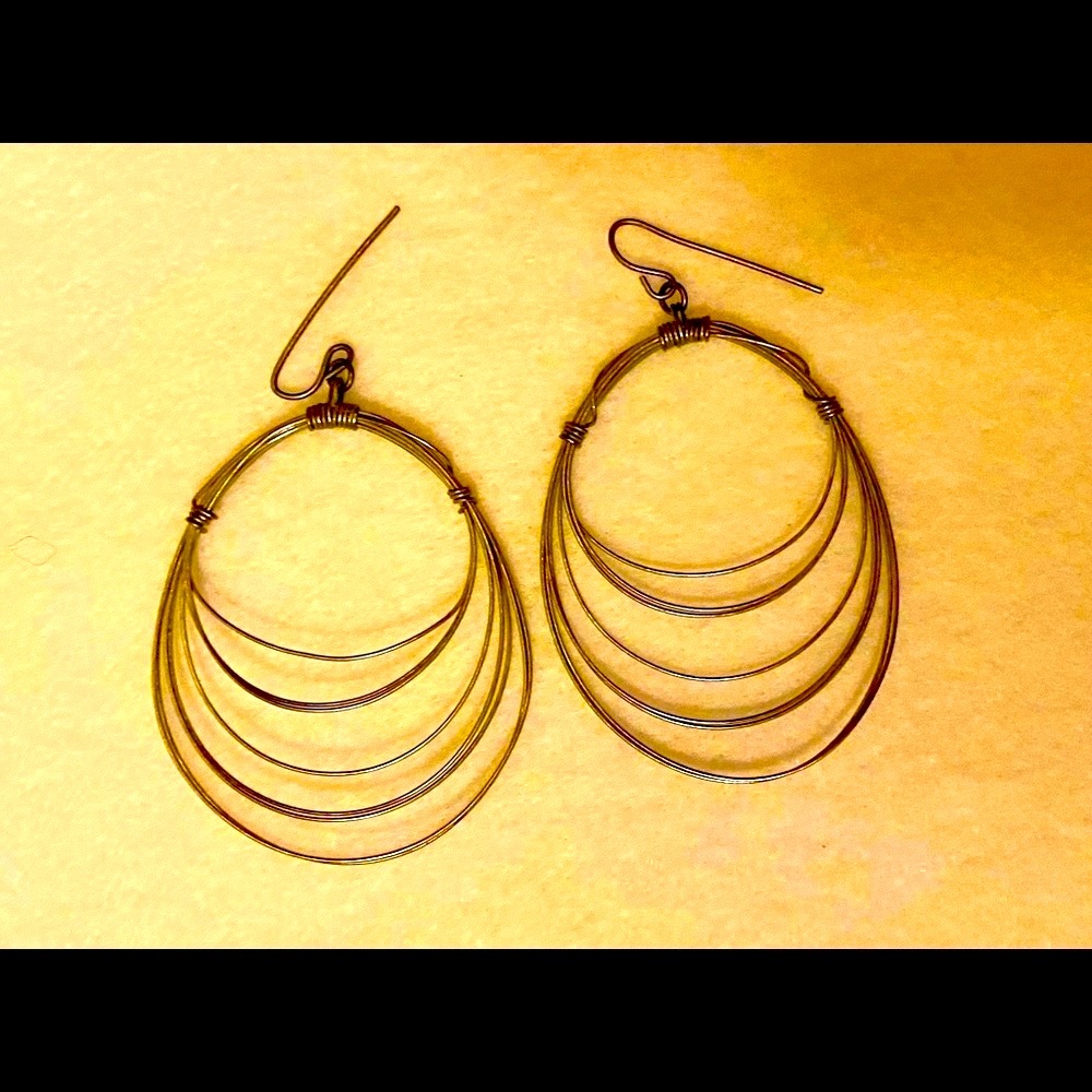 Vintage, quality and sexy 6 looped infinity hoops in pewter.